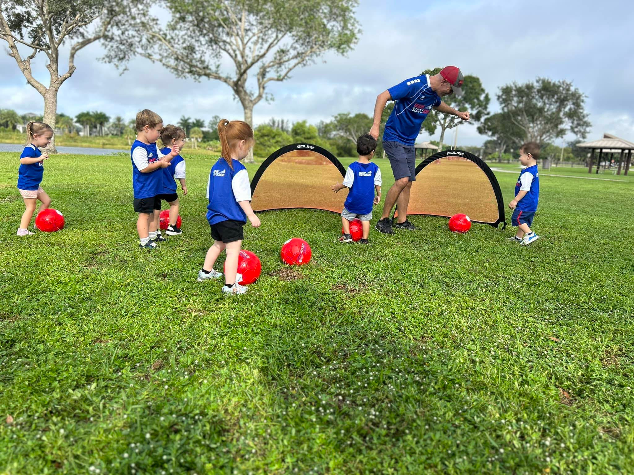 Preschool kids playing soccer